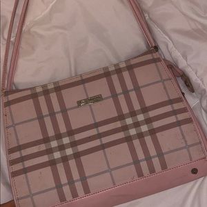 Super girly burberry purse.